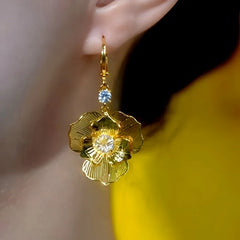Close-up detail of the sparkling zircons and plating on the Rose Earrings