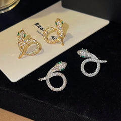 Model showcasing the dangle and style of the 14K Gold-Plated Elegant Zircon Diamond Snake Earrings
