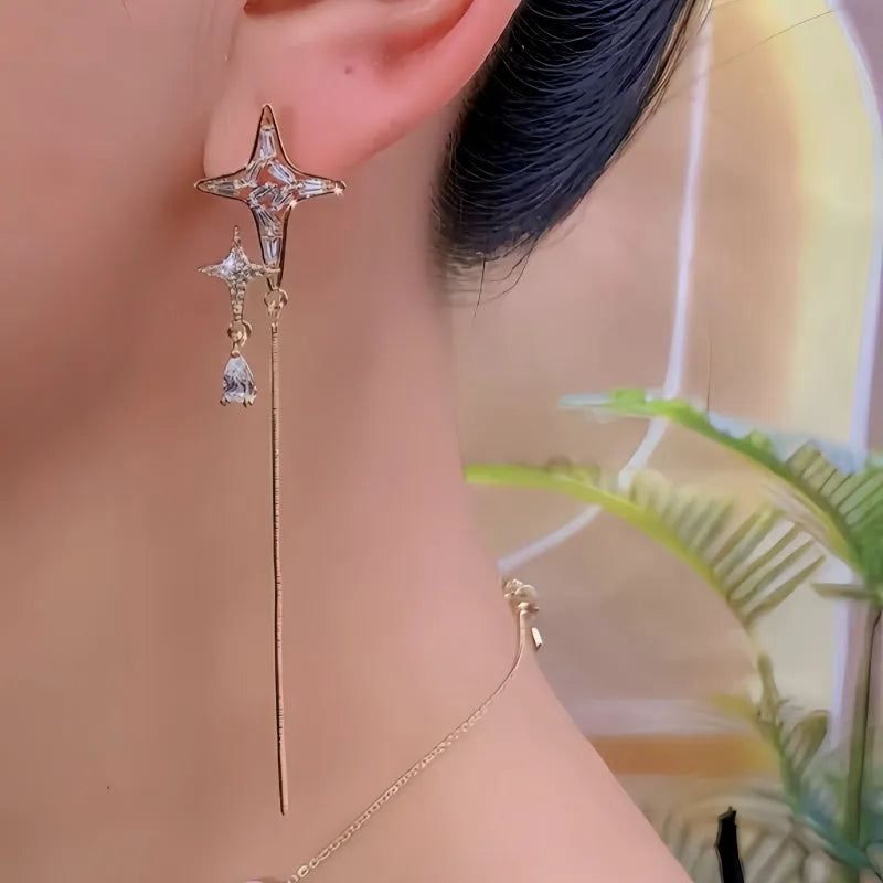 Model showcasing the dangle and style of the 14K Gold-Plated Elegant Zircon Diamond Star Tassel Earrings