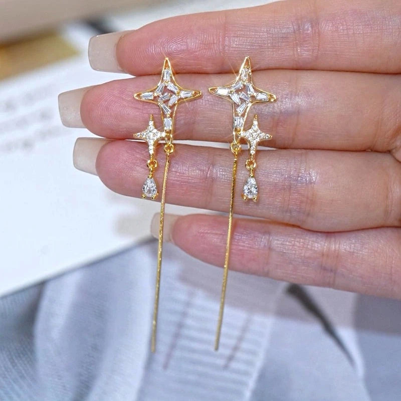 Angled view of the 14K Gold-Plated Elegant Zircon Diamond Star Tassel Earrings