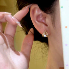 Model showcasing the dangle and style of the 14K Gold-Plated Elegant Zircon Diamond Stud Earrings