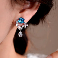 Model showcasing the dangle and style of the 14K Gold-Plated Elegant Zircon Diamond Tassel Earrings