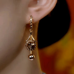 Close-up detail of the sparkling zircons and plating on the Brown Tassel Earrings