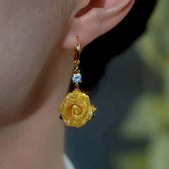 Model showcasing the dangle and style of the 14K Gold-Plated Elegant Zircon Diamond Tassel Earrings