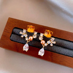 Angled view of the 14K Gold-Plated Elegant Zircon Diamond Tassel Earrings