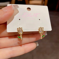 Close-up detail of the sparkling zircons and plating on the Tulip Stud Earrings