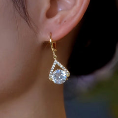 Model showcasing the dangle and style of the 14K Gold-Plated Elegant Zircon Diamond Water Drop Earrings