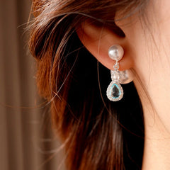 Model showcasing the dangle and style of the 14K Gold-Plated Elegant Zircon Diamond Water Drop Pearl Jacket Earrings