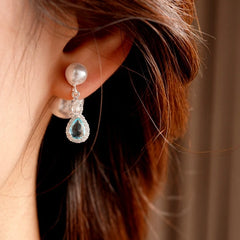 Close-up detail of the sparkling zircons and plating on the Pearl Jacket Earrings