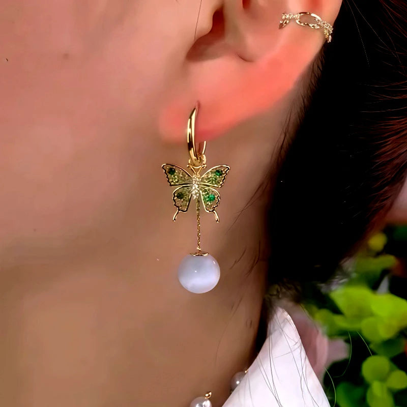 Angled view of the 14K Gold-Plated Elegant Zircon Diiamond Butterfly Cat's Eye Stone Earrings