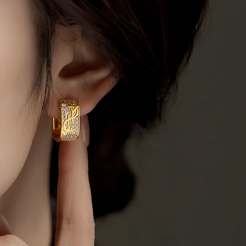 Angled view of the 14K Gold-Plated Elegant Zircon Dollar Earrings