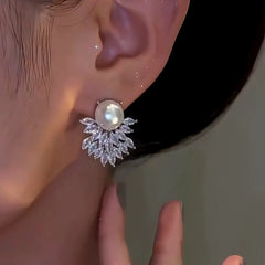 Model showcasing the dangle and style of the 14K Gold-Plated Elegant Zircon Double-Layer Pearl Earrings