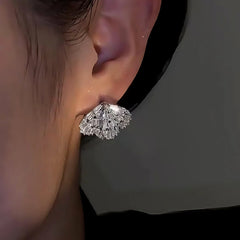 Close-up detail of the sparkling zircons and plating on the Wing Earrings