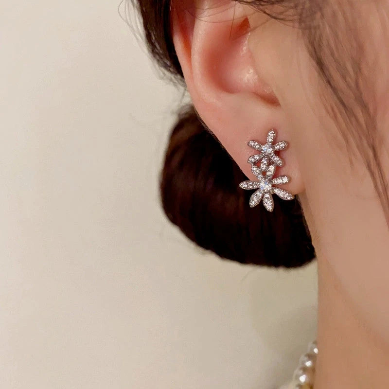 Close-up detail of the sparkling zircons and plating on the Flower Jacket Earrings