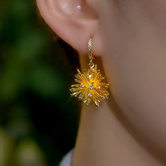 Close-up detail of the sparkling zircons and plating on the Firework Tassel Earrings