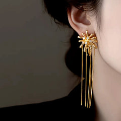 Model showcasing the dangle and style of the 14K Gold-Plated Elegant Zircon Fireworks Tassel Earrings