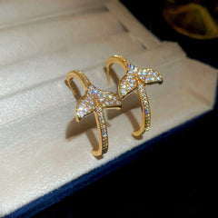 Close-up detail of the sparkling zircons and plating on the Fishtail C-Shaped Earrings