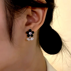 Model showcasing the dangle and style of the 14K Gold-Plated Elegant Zircon Flower Earrings