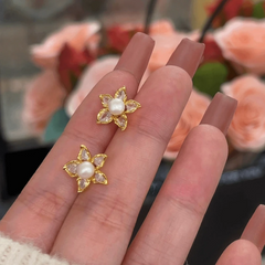 Angled view of the 14K Gold-Plated Elegant Zircon Flower Pearl Stud Earrings