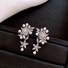 Angled view of the 14K Gold-Plated Elegant Zircon Flower Pearl Tassel Earrings