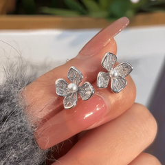 Angled view of the 14K Gold-Plated Elegant Zircon Flower Stud Earrings