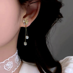 Angled view of the 14K Gold-Plated Elegant Zircon Flower Tassel Earrings