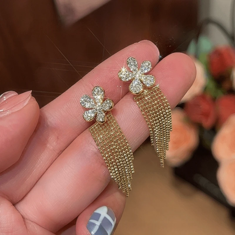 Angled view of the 14K Gold-Plated Elegant Zircon Flower Tassel Earrings