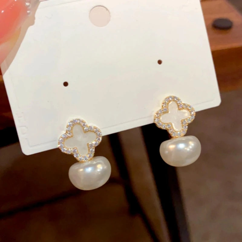 Angled view of the 14K Gold-Plated Elegant Zircon Four-Leaf Flower Pearl Earrings