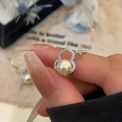 Angled view of the 14K Gold-Plated Elegant Zircon Gourd Bead Ear Hooks