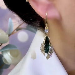 Model showcasing the dangle and style of the 14K Gold-Plated Elegant Zircon Green Crystal Ear Hook Earrings