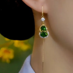 Close-up detail of the sparkling zircons and plating on the green threader earrings
