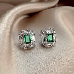 Close-up detail of the sparkling zircons and plating on the green stud earrings
