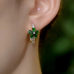 Close-up detail of the sparkling zircons and plating on the green flower earrings
