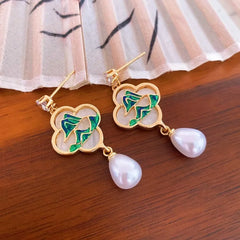 Angled view of the 14K Gold-Plated Elegant Zircon Green Mountain Pearl Tassel Earrings