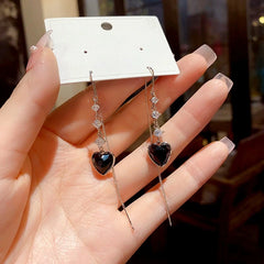 Close-up detail of the sparkling zircons and plating on the gold threader earrings