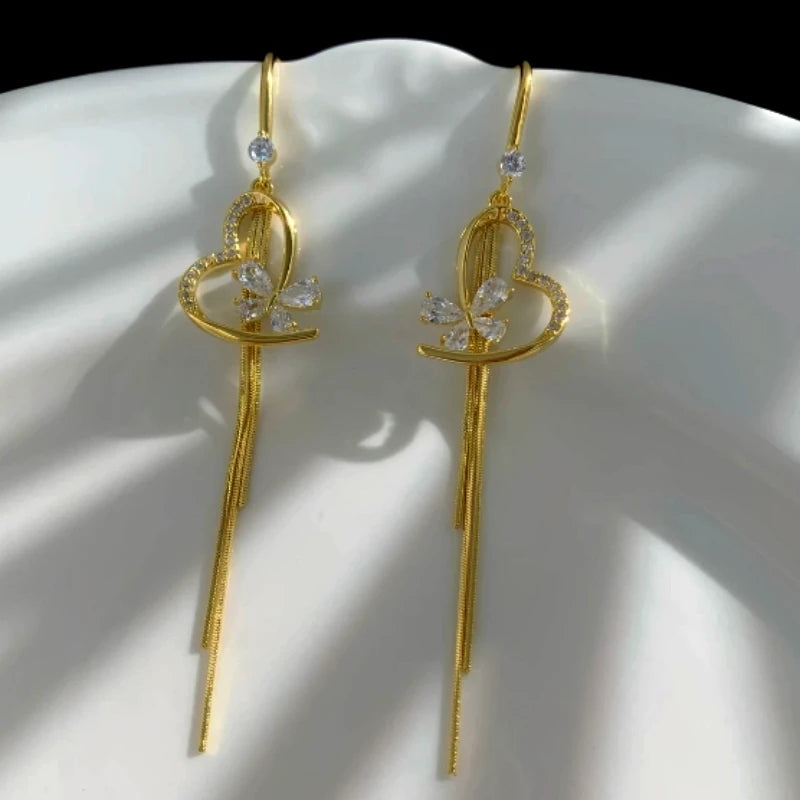 Angled view of the 14K Gold-Plated Elegant Zircon Heart Butterfly Tassel Ear Hooks