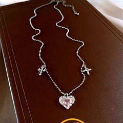 Close-up of the pendant and clasp on the silver heart necklace