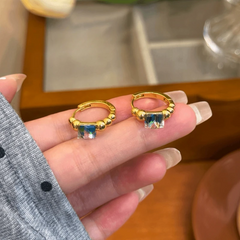Angled view of the 14K Gold-Plated Elegant Zircon Hoop Earrings
