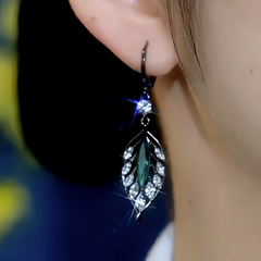 Close-up detail of the sparkling zircons and plating on the gold leaf earrings