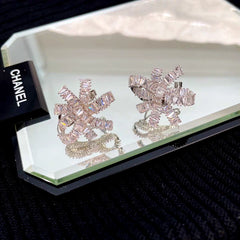 Angled view of the 14K Gold-Plated Elegant Zircon Knotted Flower Earrings