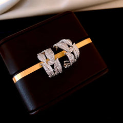 Model showcasing the dangle and style of the 14K Gold-Plated Elegant Zircon Leaf C-Shaped Earrings