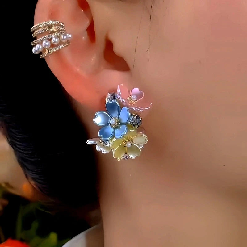Close-up detail of the sparkling zircons and plating on the gold leaf earrings