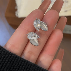 Angled view of the 14K Gold-Plated Elegant Zircon Leaf Stud Earrings