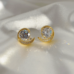 Model showcasing the dangle and style of the 14K Gold-Plated Elegant Zircon Moon Stud Earrings