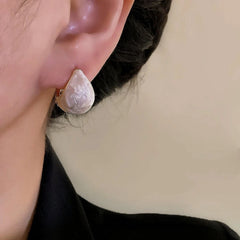 Model showcasing the dangle and style of the 14K Gold-Plated Elegant Zircon Oil Drop Double-Sided Earrings