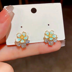 Angled view of the 14K Gold-Plated Elegant Zircon Oil Drop Flower Stud Earrings