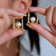 Angled view of the 14K Gold-Plated Elegant Zircon Pearl Earrings