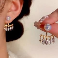 Angled view of the 14K Gold-Plated Elegant Zircon Pearl Jacket Earrings