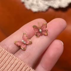 Angled view of the 14K Gold-Plated Elegant Zircon Pink Butterfly Stud Earrings