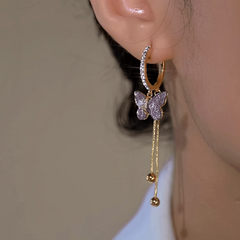 Close-up detail of the sparkling zircons and plating on the Purple Crystal Butterfly Earrings